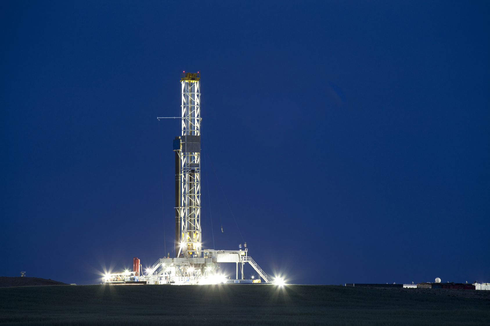 A well drilling rig works in the eastern plains of Colorado to reach the Niobrara Shale formation.  Once the well is drilled and perforated, water, sand and chemicals will be injected under high pressure to fracture the shale, releasing oil and gas.